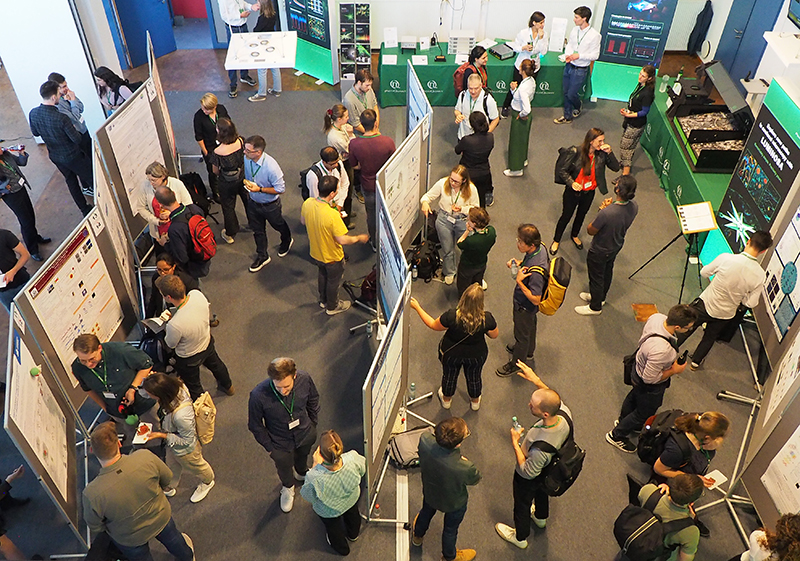 people meeting and talking at the poster session
